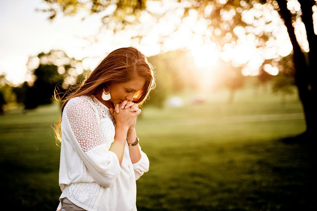 Person praying in quiet reflection